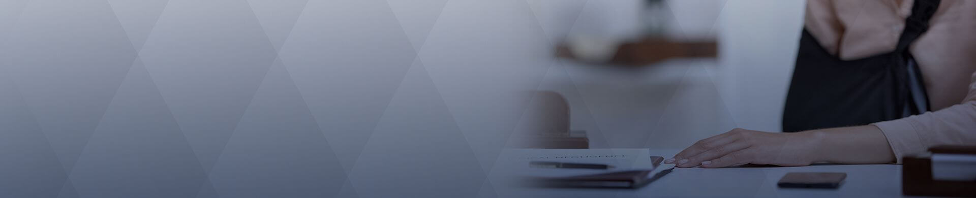 Person filling out intake paperwork